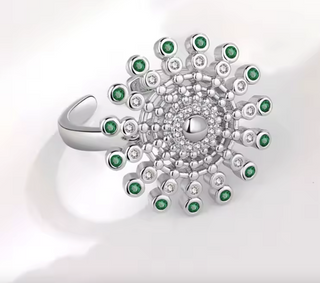 Anillo antiestrés ajustable sol con circonitas verdes