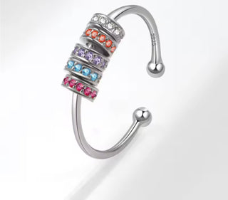 Anillo antiestrés ajustable  con cuentas giratorias de colores