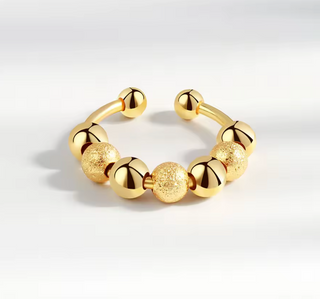 anillo antiestrés bolitas giratorias plata