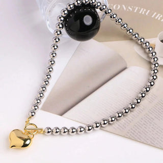 collar de bolas con corazón de acero inoxidable