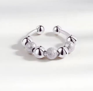 	anillo relajante discreto bolitas