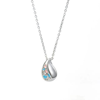 Colgante para cenizas en forma de lágrima con corazones azul y rosa - joya conmemorativa en acero
